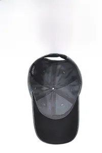 Detail view of cotton baseball cap interior showing six-panel stitching and metal buckle