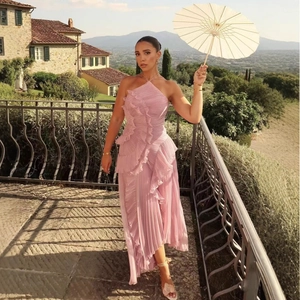 Elegant mauve halter pleated maxi dress with ruffled layers for evening occasions