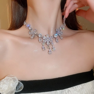 Close-up of luxury flower and water drop pendant necklace with shimmering zircon crystals