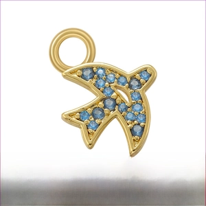 Macro detail of bird pendant with micro-paved blue zircons on 14mm gold-plated brass