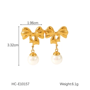 Front view of gold bow-shaped earrings with pearls including size 1.96cm by 3.32cm