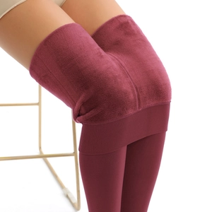 Close-up of deep wine red leggings showing the thick warm fleece lining and high waist