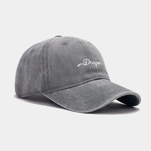 Washed dark grey baseball cap with white Dragon embroidery for a vintage street style look