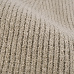 Winter outdoor patchwork knit beanie featuring thick rib-stitch texture in beige color
