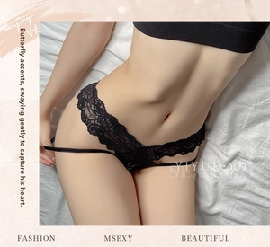 Close-up of black lace thong featuring hollow-out V-waist and floral embroidery details