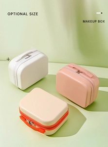 Three 14-inch mini hardshell makeup cases in white, pink, and beige with top handles