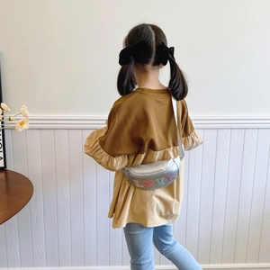 Kids silver sequin waist bag with rainbow strap and LOVE patch on a model girl