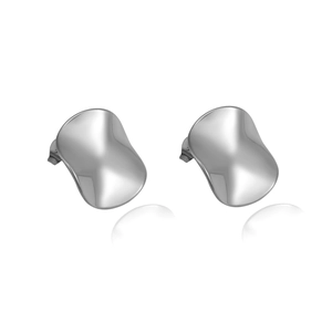 Macro shot of silver irregular geometric stud earrings with polished mirror finish texture