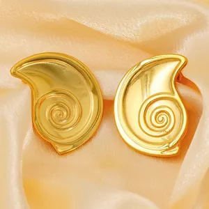 Polished 18K gold-plated stainless steel shell-shaped stud earrings on silk fabric