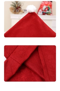 Detail of red non-woven Christmas chair cover featuring high-quality stitching and pom-pom