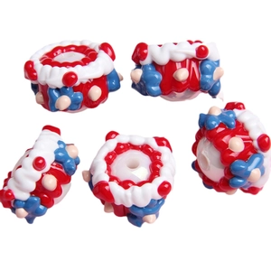 Winter collection of red and blue hand-painted crown beads for DIY jewelry making