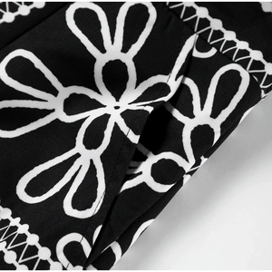 Macro shot of black and white floral print fabric texture on casual fashion suit set