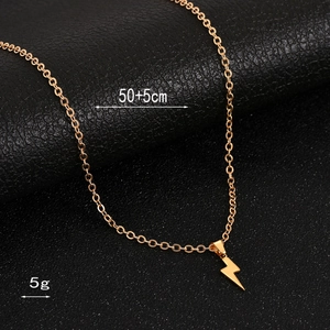 Detail view of gold lightning bolt necklace with dimensions 50+5cm and weight of 5g