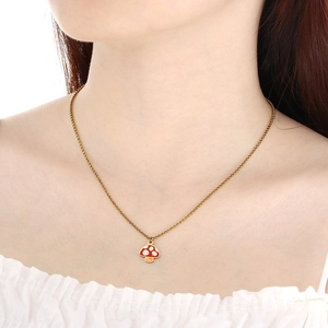Gold chain necklace with red mushroom pendant shown on a female model for daily wear