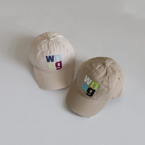 Kids vintage baseball cap in beige and khaki with embroidered lettering and distressed detail