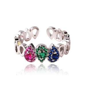 Macro detail of silver open ring featuring three colorful pear-cut gemstones and tiny diamonds