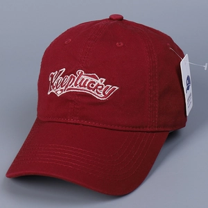 Detail of red cotton baseball cap with white Keeplucky embroidery and original product tag
