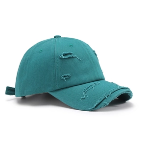 Distressed washed cotton baseball cap with ripped details in teal blue for outdoor wear