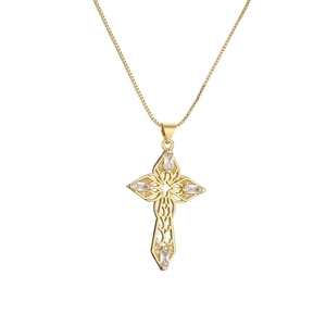 Iced out cross pendant necklace with sparkling cubic zirconia on a gold box chain