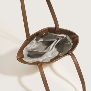 Brown faux leather tote bag with inner lining, zipper pocket and magnetic closure