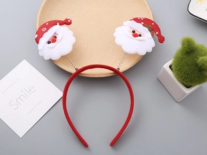 Close-up of Santa Claus headband with bouncy metal springs and soft plush fabric detail