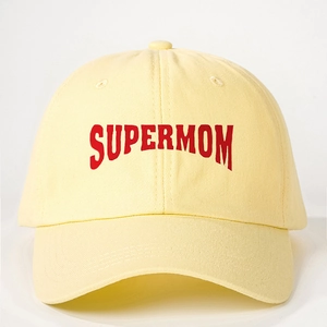Pale yellow cotton baseball cap featuring a red curved SUPERMOM print on the front