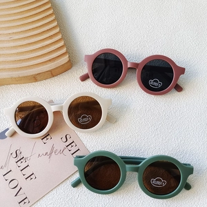 Retro round matte kids sunglasses with UV400 protection in diverse earthy colors