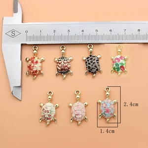 Set of seven colorful alloy turtle charms with enamel detailing for DIY jewelry making