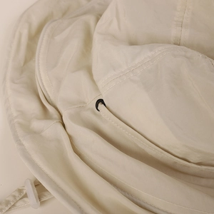 Detail shot of the durable fabric and neat stitching on this beige sun hat