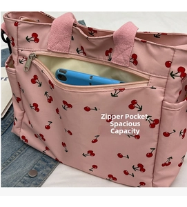 Pink cherry print tote bag featuring a practical front zipper pocket for smartphone storage
