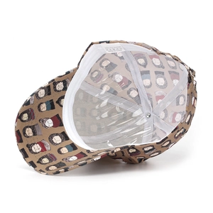 Detailed interior of cartoon print baseball cap showing 100% polyester label and sweatband
