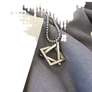 Polished silver stainless steel interlocking triangle pendant necklace on a box chain