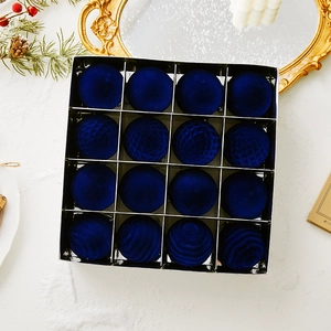 Set of 16 deep blue flocked Christmas balls with various textures in a transparent box
