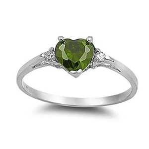 Close-up of olive green heart-shaped gemstone ring with side diamonds and silver band