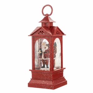 Red Christmas lantern music box with Santa Claus inside and snowy finish on the frame
