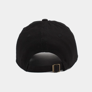Detail view of the black cotton baseball cap with adjustable bronze metal buckle