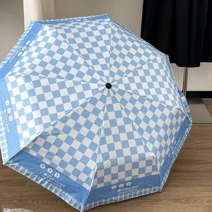 Blue and white checkered UV protection umbrella with motivational text and wooden handle