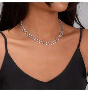 Close-up of S925 silver fringe necklace with sparkling cubic zirconia on a model