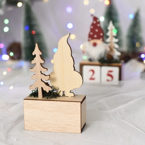 Close-up of wooden Christmas gnome and tree ornaments with festive bokeh background