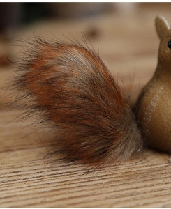 Macro shot showing the realistic fur texture and tail detail of a foam squirrel ornament