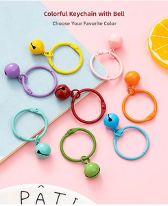 Detail of colorful matte metal keychains with matching bells in vibrant candy tones