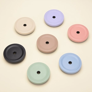 Top view of multi-colored matte 10.1cm stainless steel tumbler lids with straw holes