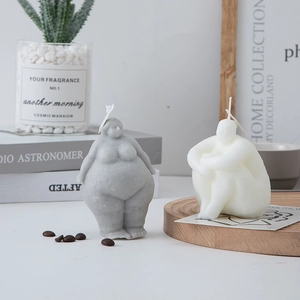 Artistic body shaped aromatherapy candles in grey standing and white sitting poses