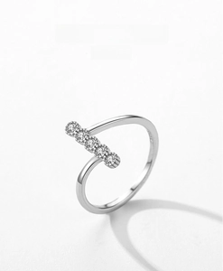 Detail of S925 sterling silver ring with asymmetric geometry and five inset zircons