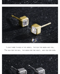 Détails macro des boucles d'oreilles carrées en zircon doré et argenté sur argent S925