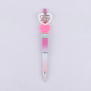 Nurse themed beadable pen with pink gradient barrel and heart shaped topper charm