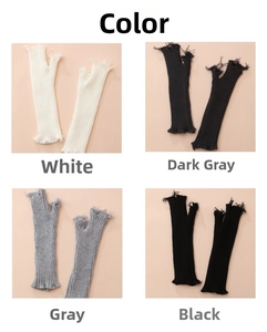 Close-up of distressed knit arm warmers in white, grey and black with frayed hole details