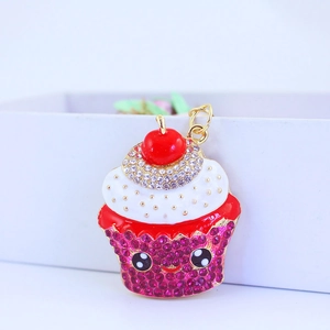 Creative cupcake keychain with sparkling purple rhinestones and cute cartoon face