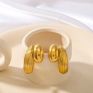 Textured gold-plated stainless steel C-shaped hoop earrings with a grooved geometric design