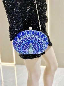 Detail of peacock rhinestone evening clutch bag with blue crystal patterns and spherical clasp